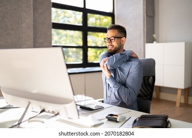 Shoulder Pain And Posture. Man Suffering Near Workstation Computer