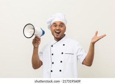 Shout Out Loud Order Excited Face With Mega Phone Young Handsome Asian Man Boss Chef In Uniform Command Order The Staff For Menu On Isolated. Cooking Indian Man Chef In Kitchen Restaurant And Hotel.