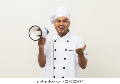 Shout Out Loud Order Excited Face With Mega Phone Young Handsome Asian Man Boss Chef In Uniform Command Order The Staff For Menu On Isolated. Cooking Indian Man Chef In Kitchen Restaurant And Hotel.