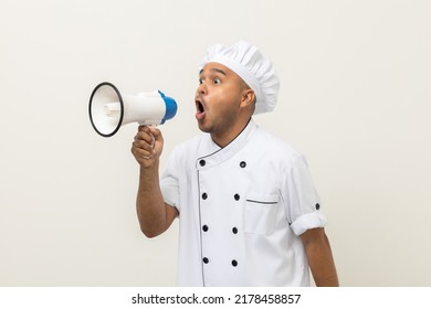 Shout Out Loud Order Excited Face With Mega Phone Young Handsome Asian Man Boss Chef In Uniform Command Order The Staff For Menu On Isolated. Cooking Indian Man Chef In Kitchen Restaurant And Hotel.