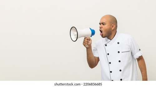 Shout Out Loud Order Excited Face With Mega Phone Young Handsome Asian Man Boss Chef In Uniform Command Order The Staff For Menu On Isolated. Cooking Indian Man Chef In Kitchen Restaurant And Hotel.