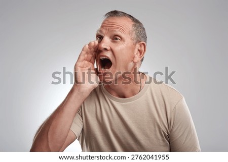 Shouting, alert or man in studio with space, warning or announcement for attention. Beware expression, mockup or mature person on white background with yelling, difficulty or scream in bad situation.