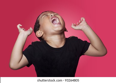 Shouting Angry Asian Kid On Red Background