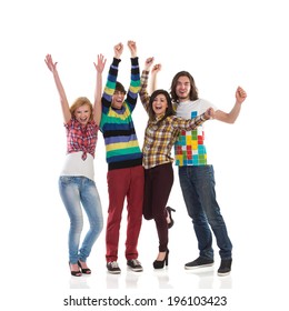Shouting Group Of College Students. Four Young Happy People Shouting With Arms Raised. Full Length Studio Shot Isolated On White.