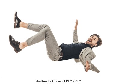 shouting young businessman in suit falling isolated on white