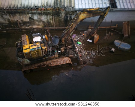 Shovel bucket on river bank, excavators