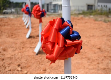 Shovel Decorate With Ribbon For Groundbreaking Ceremony With Beautiful Clear Blue Sky