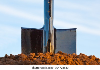 Shovel In The Heap Of Ground Against Blue Sky