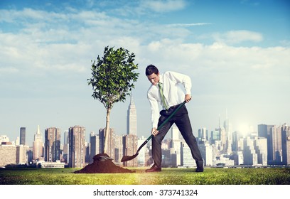 Shoveling Business District Cityscape Growth Tree Concept