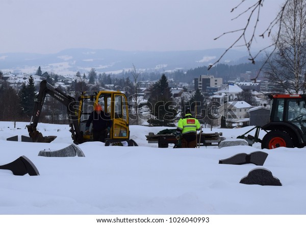 Shoveling snow\
from the graveyard cemetery - Workers from Adecco - Kongsvinger,\
Norway (16th February\
2018)