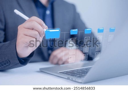 Show document management system on laptop. Managing corporate file information, document work management with technology software for archiving 