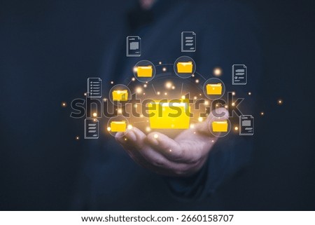 Show document management system on hand. Managing corporate file information, document work management with technology software for archiving, document, technology, quality, file