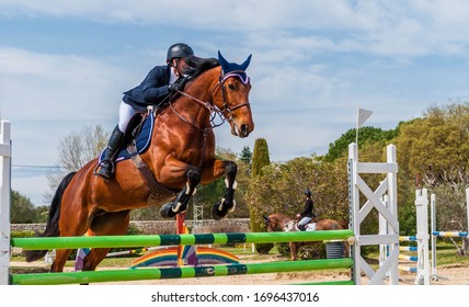 Show Jumping Competition On Horseback.