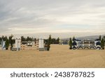 Show jumping poles obstacles, barriers, waiting for riders on show jumping training.