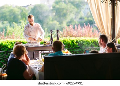 Show Kitchen. The cook prepares Carpaccio Family for the guests of the restaurant. - Powered by Shutterstock