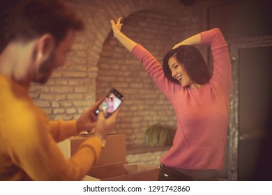 Show Me Your Happiness. Couple In The New Home. Man Taking Picture Of His Girlfriend. Copy Space.