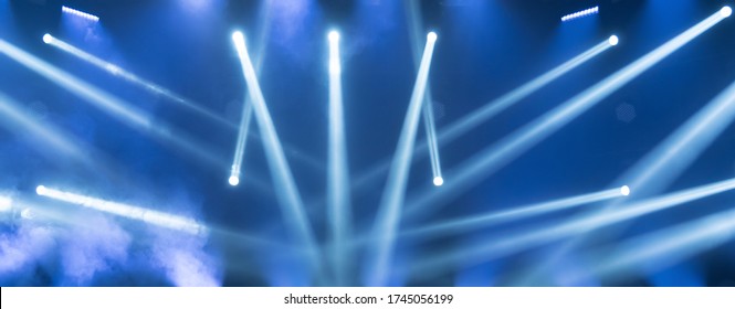 Show Must Go On. Empty Stage With Blue Spotlights. Blue Stage Lights. Concert Live Streams Available Online. Background For Online Concert. Live Streaming Concert. Online Event. Stage For Musicians