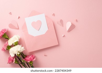 Show your appreciation this Mother's Day with a stunning postcard arrangement featuring pink carnations, and heart-shaped papers on a pastel pink background - Shutterstock ID 2287404349
