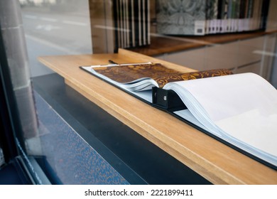 Showasce Store Window With Open Book Showing Luxury Wallpaper