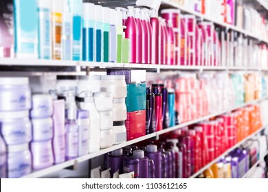  Showcase With Bottles Of Shampoos And Conditioners In The Hair Care Store.