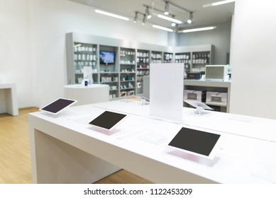 Showcase With Tablets In The Light Modern Tech Store. Tablets On A Showcase In A Light Electronics Store.