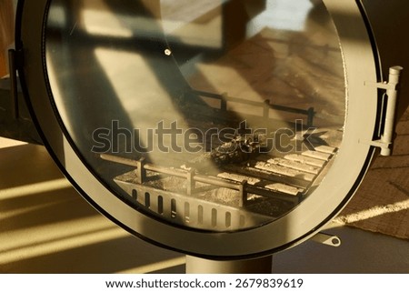 Showcase of a Tank Model Display through an Intriguing Circular Lens for Artistic Perspective