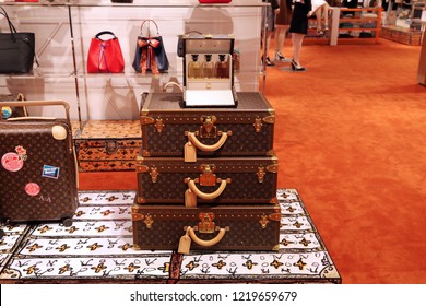 Showcase with Trendy suitcases and bags in the luxury Louis Vuitton store. Moscow. 01.11.2018