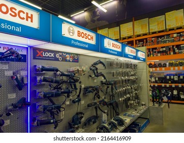 Showcases And Shelves With Construction Tools In A Shopping Mall. Hardware Store. Products Of The BOSCH Company. 03 June 2022, Minsk, Belarus