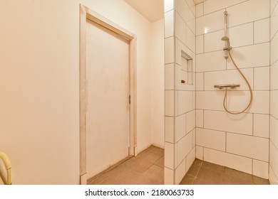 Shower Column In Expensive Open Bathroom With Gray Tiled Wall And Window