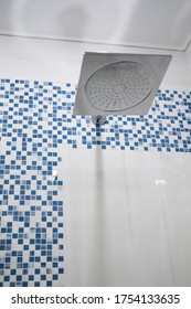 Shower Cubicle Decorated With Square Tiles In White And Blue.