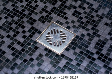 Shower Drain In A Stone Dark Gray Bathroom