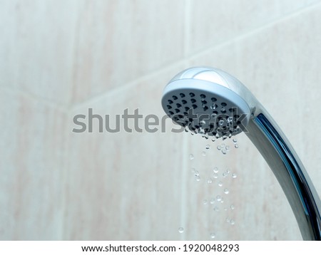 Shower head with low water stream. Broken shower in the bashroom