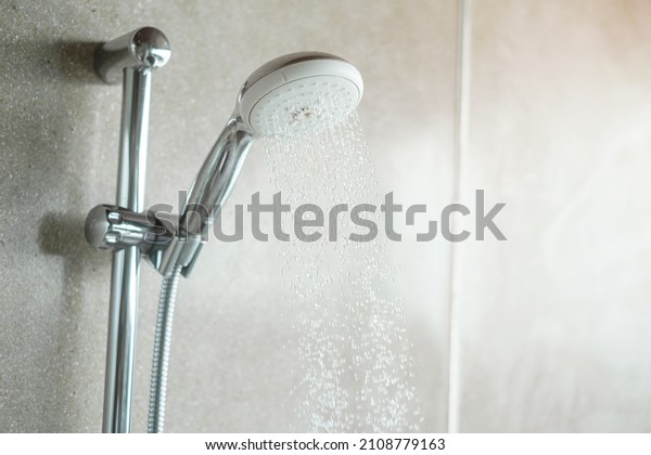 \
shower head with wall background in modern\
bathroom