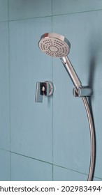 Shower Knob On Blue Tiles