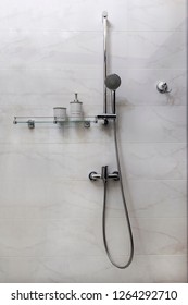 Shower Set Ion A Marble Wall With A Glass Shelf And Accessories
