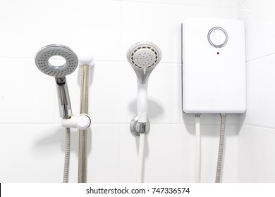 Shower And Water Heater In White Bathroom