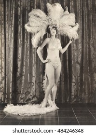 Showgirl Wearing Feather Headdress And Sequined Bikini