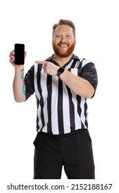 Showing Device Screen. Portrait Of Young Bearded Man, Soccer Or Football Referee Using Phone Isolated On White Studio Background. Concept Of Sport, Rules, Competitions, Rights, Ad, Sales.