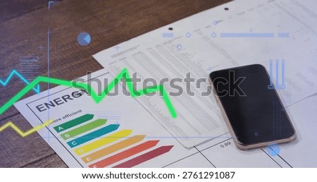 Showing efficiency chart and spreadsheet on wood desk, with smartphone and green-blue HUD overlay. Bargraph, report, data, phone, office, workstation, analytics