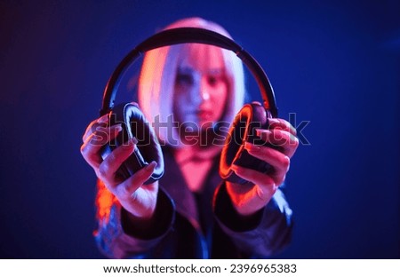 Similar – Young woman listening to music