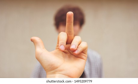 Showing A Middle Finger To The Person. Disrespect Sign 