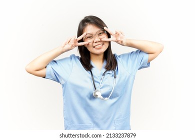 Showing Peace Sign Of Asian Young Doctor Isolated On White Background