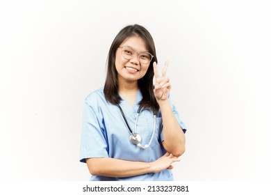 Showing Peace Sign Of Asian Young Doctor Isolated On White Background