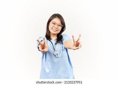 Showing Peace Sign Of Asian Young Doctor Isolated On White Background