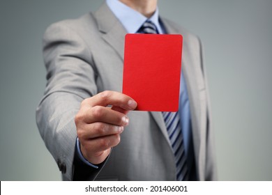 Showing The Red Card Concept For Bad Business Practice, Exclusion Or Criminal Activity