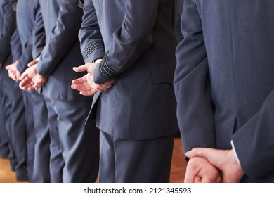 Showing Respect. Shot Of A Group Of Air Force Personnel Standing At Ease.