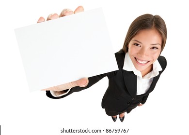 Showing Sign - Woman Holding Big Business Card / Paper Sign With Copy Space. Sign And Businesswoman Face Both In Focus. High Angle Full Length View Of Happy Smiling Woman Isolated On White Background.