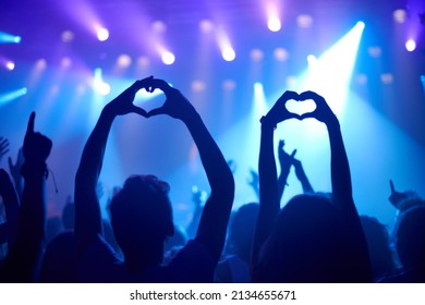 Showing Their Love. Shot Of Adoring Fans At A Rock Concert.