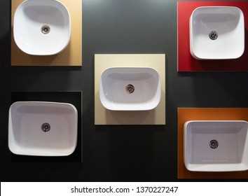 Showroom With Different White Washbasins Hanging On A Wall At DIY Furniture Hardware Store