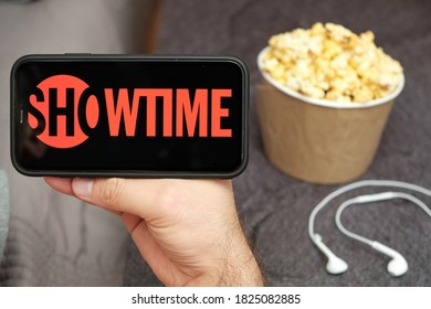 Showtime Logo On The Mobile Phone Screen With Popcorn Box And Apple Earpods On The Background, September 2020, San Francisco, USA